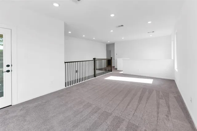 a view of a park with slide and a bench