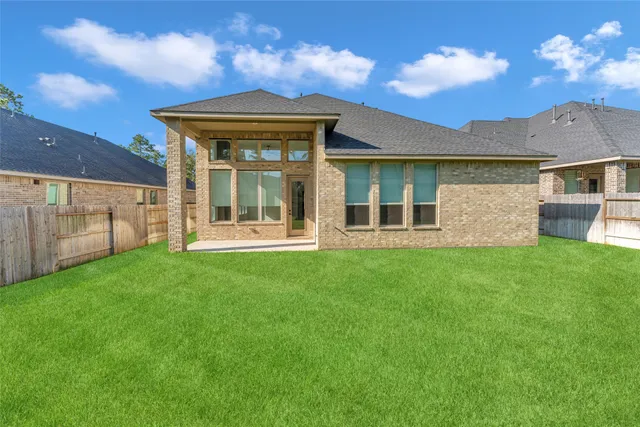 front view of a house with a garden