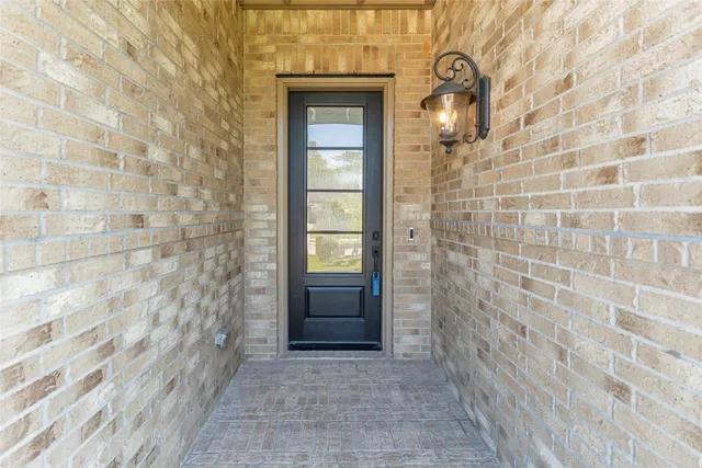 a view of kitchen with stainless steel appliances granite countertop a stove a sink and a refrigerator