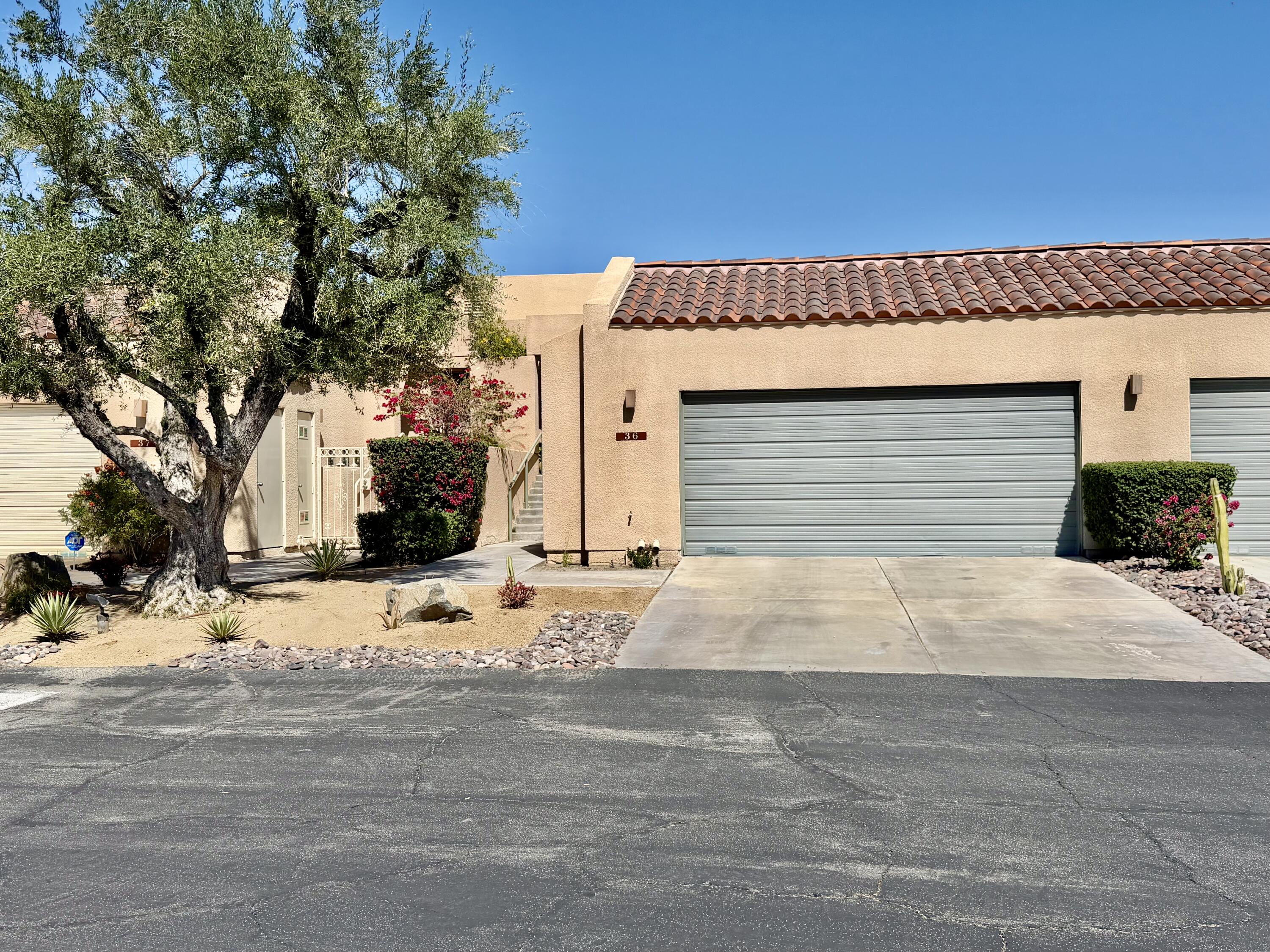 a front view of a house with a outdoor space