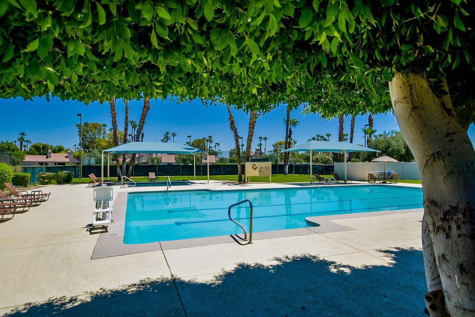 36 Mission Court Rancho Mirage, CA 92270 - Photo 13 of 17 a view of backyard with swimming pool and outdoor seating
