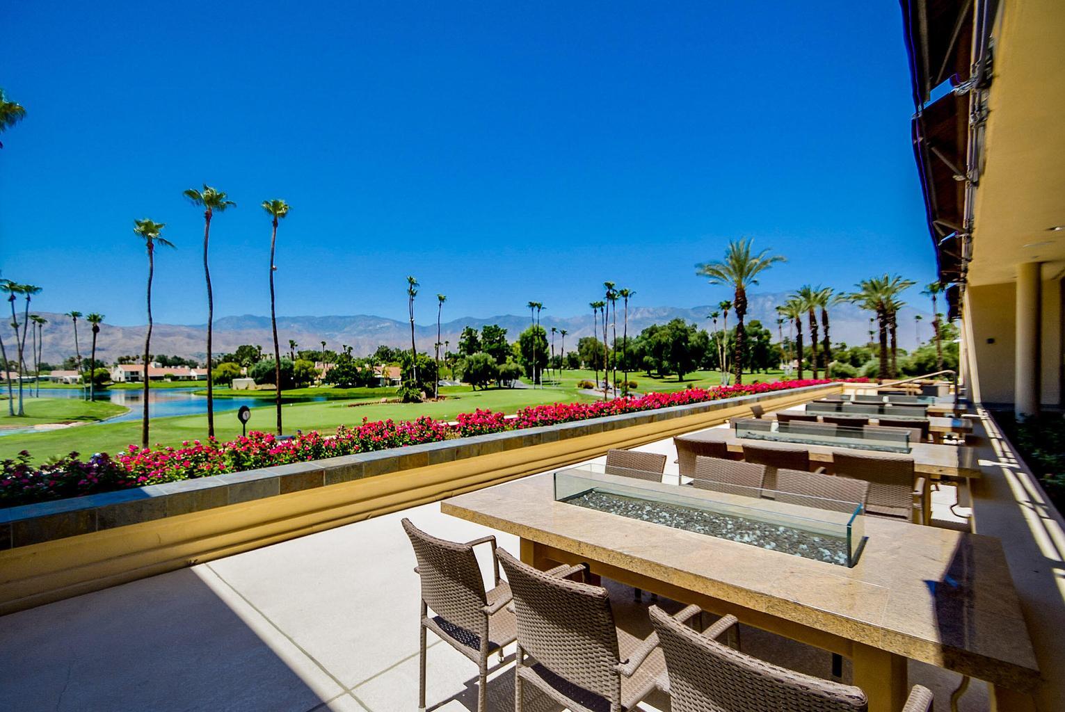 36 Mission Court Rancho Mirage, CA 92270 - Photo 16 of 17 a view of a swimming pool with outdoor seating and plants