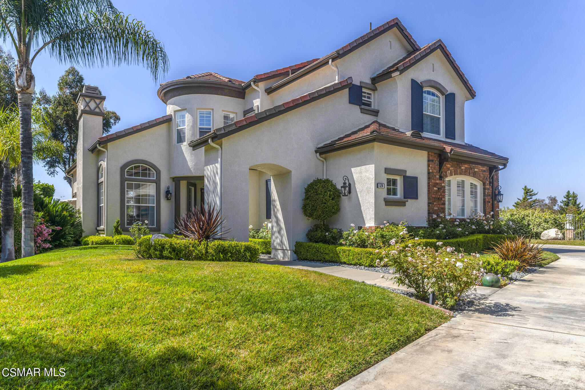 524 Oak Tree Court Simi Valley, CA 93065 - Photo 1 of 61 a front view of a house with a yard and potted plants