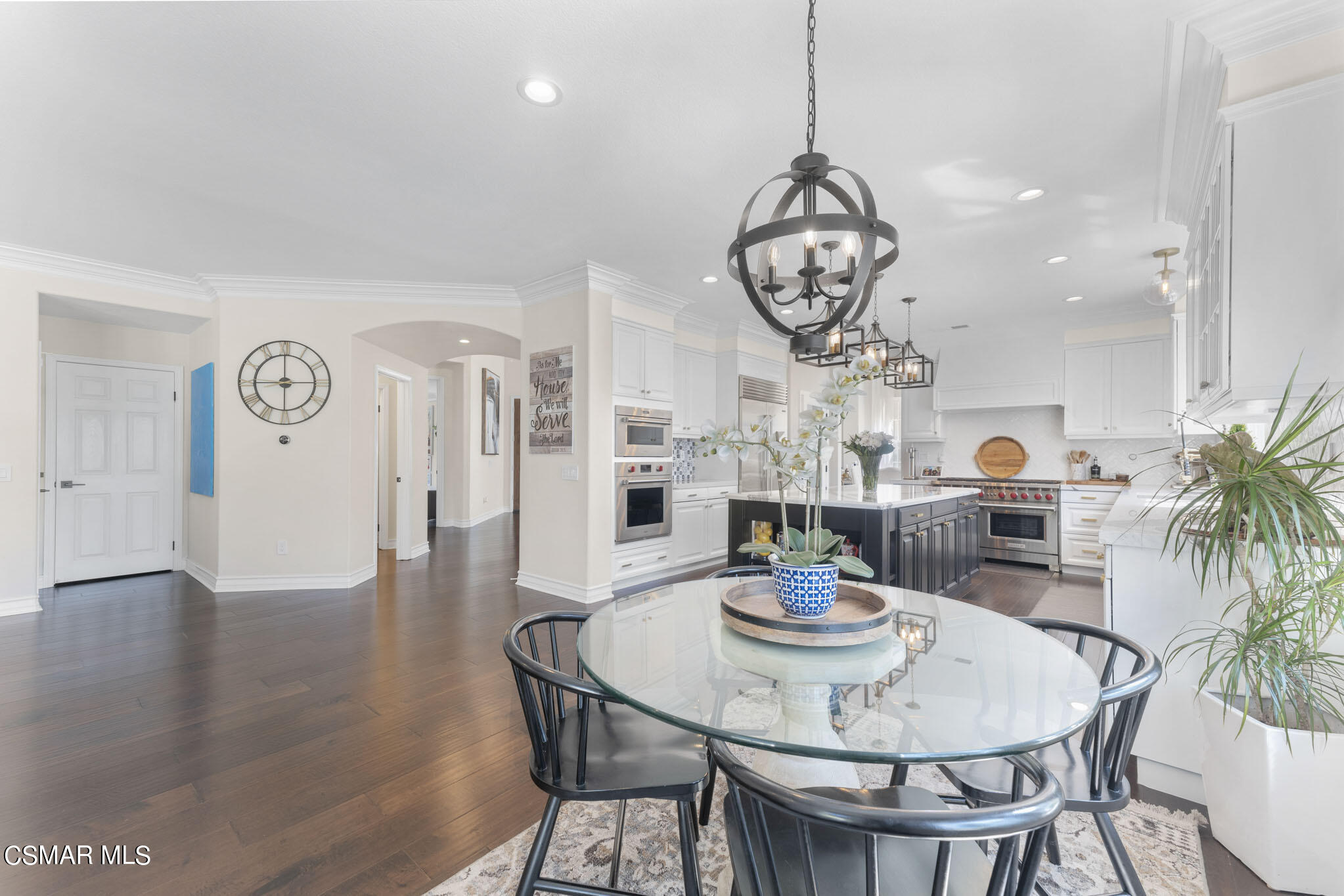 524 Oak Tree Court Simi Valley, CA 93065 - Photo 18 of 61 a view of a dining room with furniture a chandelier and wooden floor