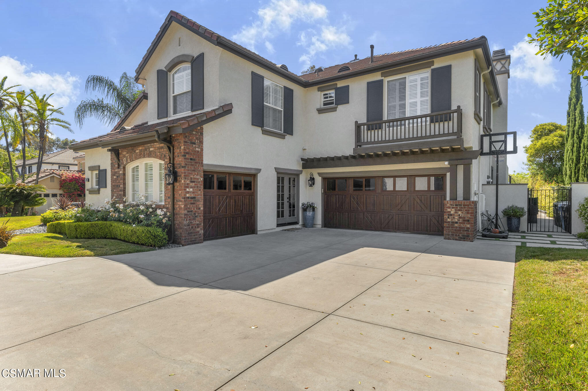 524 Oak Tree Court Simi Valley, CA 93065 - Photo 2 of 61 a front view of a house with a yard and potted plants