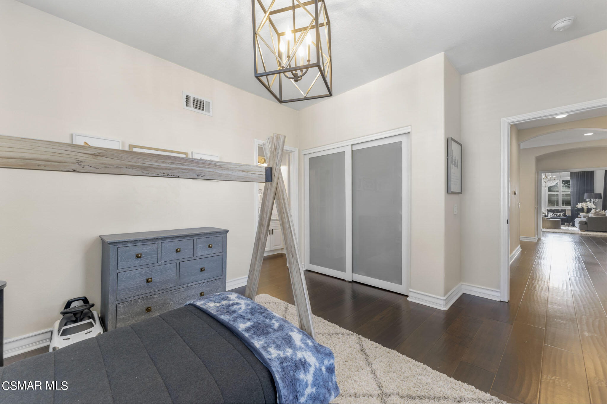 524 Oak Tree Court Simi Valley, CA 93065 - Photo 40 of 61 a bedroom with a bed and wooden floor