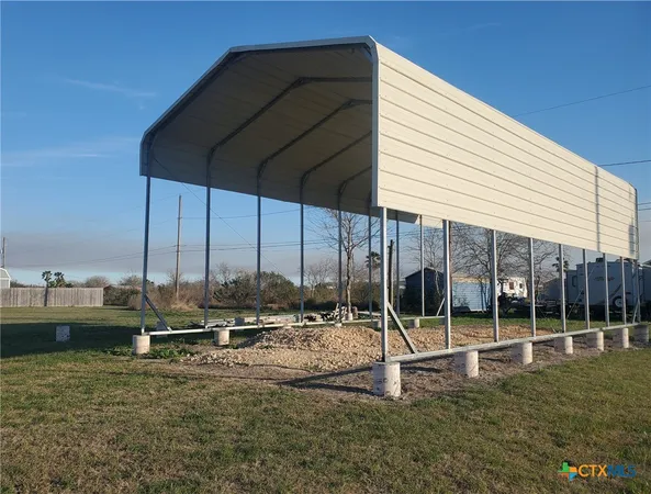 a view of a park with chairs