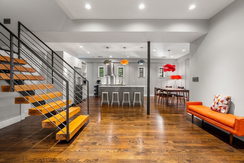 a living room with lots of furniture and white walls