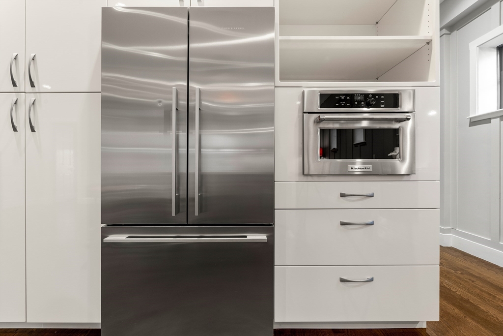 653 East 3rd Street Boston, MA 02127 - Photo 16 of 38 a kitchen with a refrigerator and microwave