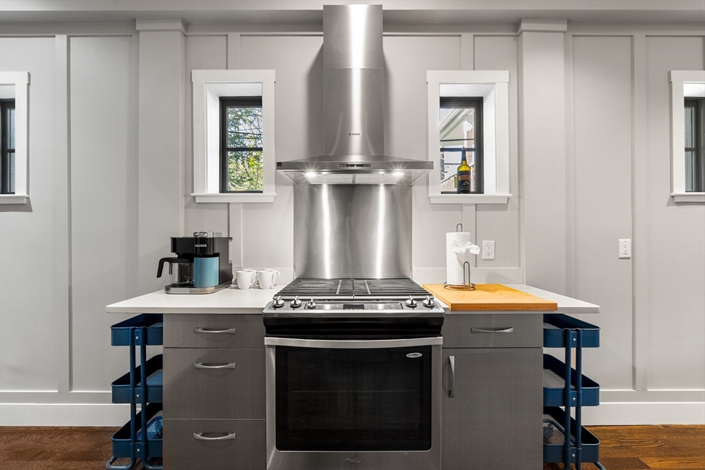 653 East 3rd Street Boston, MA 02127 - Photo 17 of 38 a kitchen with stainless steel appliances granite countertop a stove and a sink