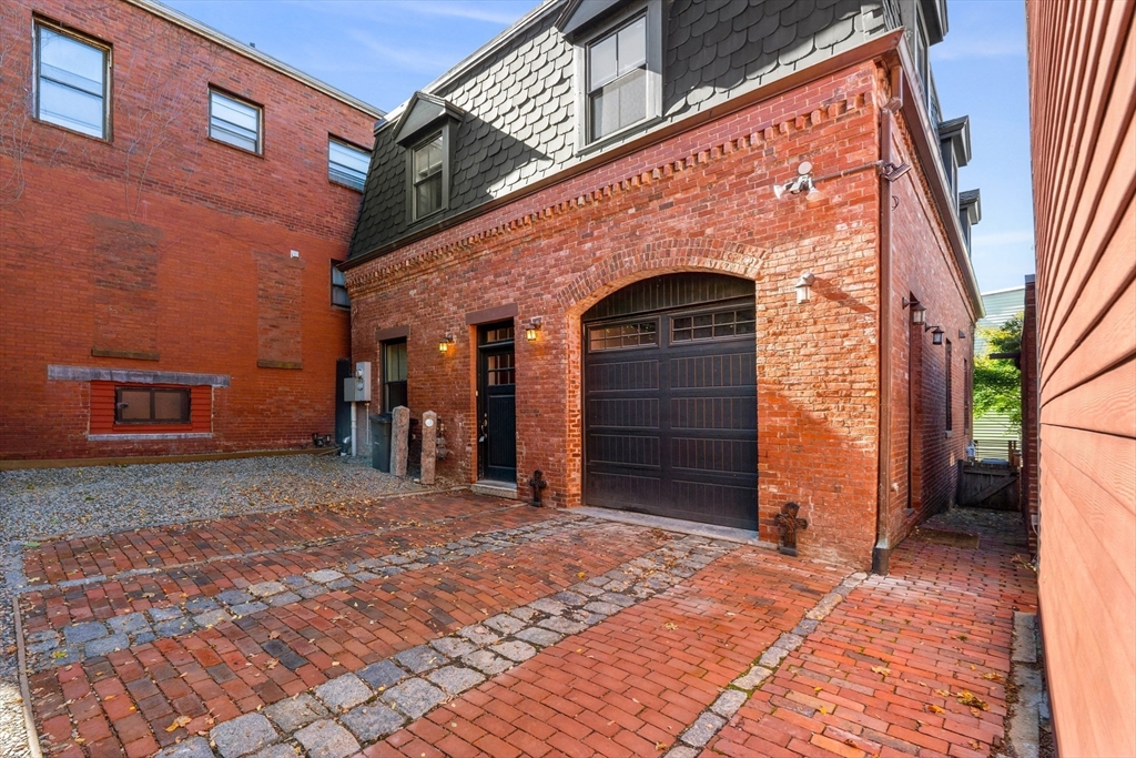 653 East 3rd Street Boston, MA 02127 - Photo 2 of 38 a view of a house with a door and wooden walls
