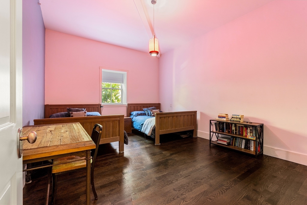 653 East 3rd Street Boston, MA 02127 - Photo 36 of 38 a living room with furniture and a wooden floor