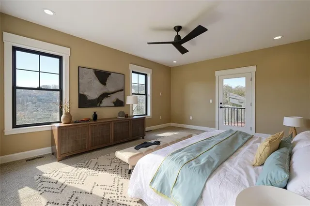 a bedroom with a bed and window