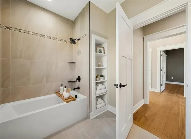 a bathroom with a bathtub and a shower