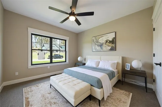 a spacious bedroom with a bed and a window