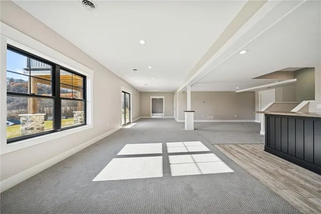 a view of a hallway with windows