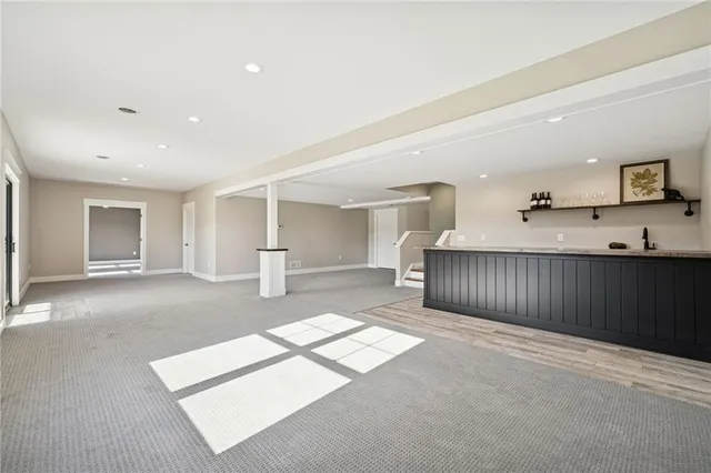 a view of a hallway with cabinet and living room
