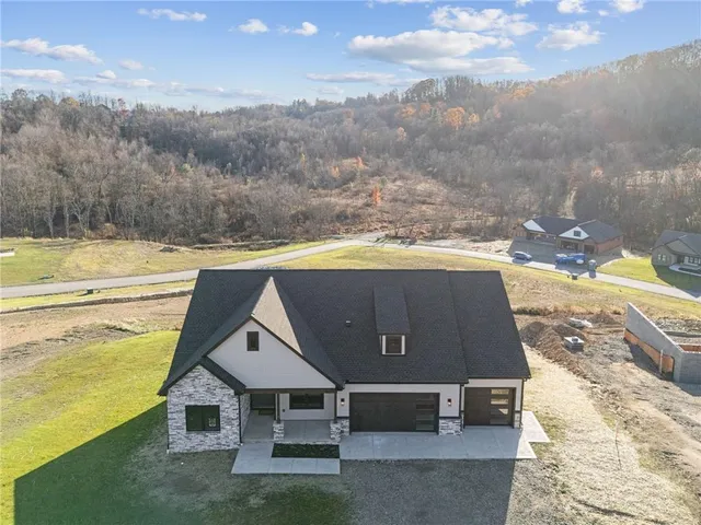 a view of a terrace with a table and chairs