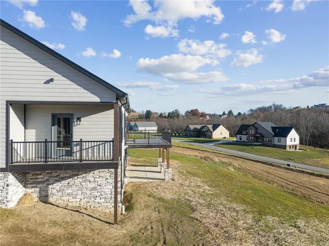 a view of a swimming pool with an outdoor seating