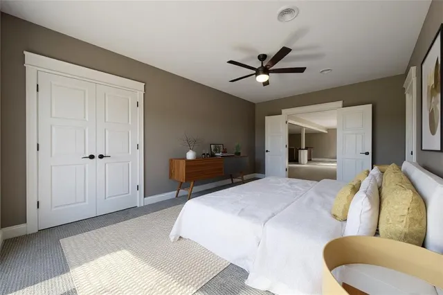 a bedroom with a bed furniture and a window