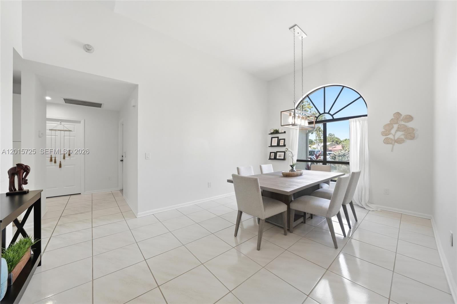 11008 Boca Woods Lane Boca Raton, FL 33428 - Photo 10 of 70 a view of a dining room with furniture