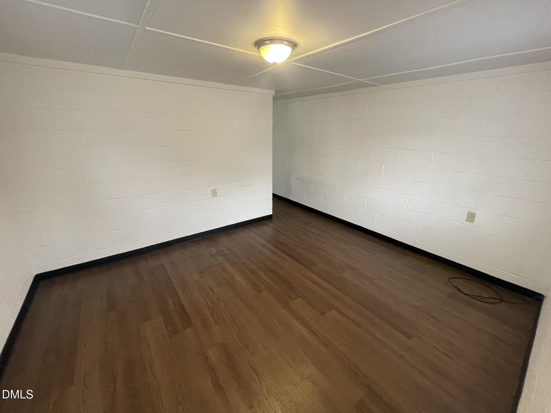 820 Coleman Street, Unit 1/2 Raleigh, NC 27610 - Photo 2 of 8 a view of a room with wooden floor