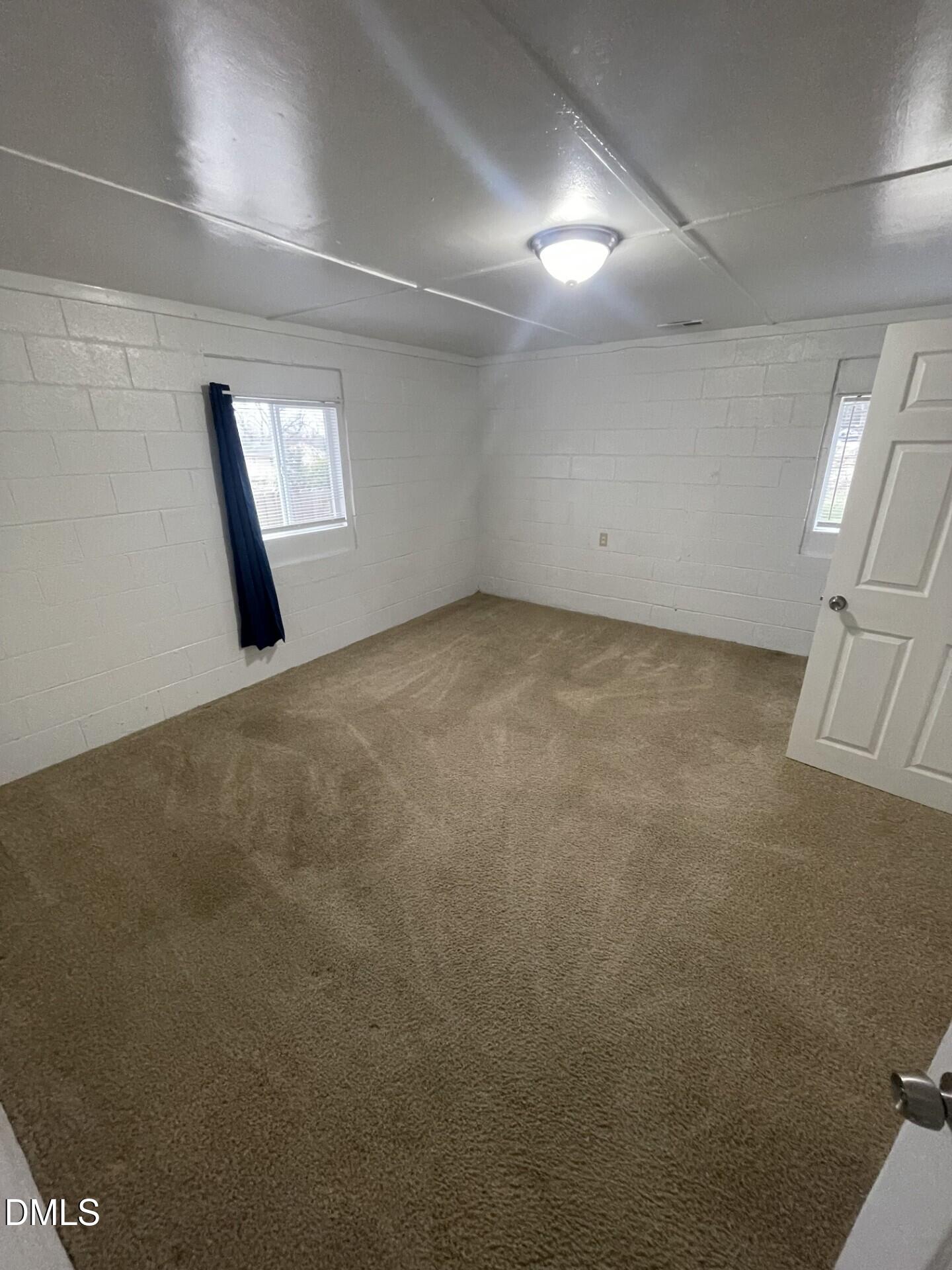 820 Coleman Street, Unit 1/2 Raleigh, NC 27610 - Photo 8 of 8 an empty room with windows