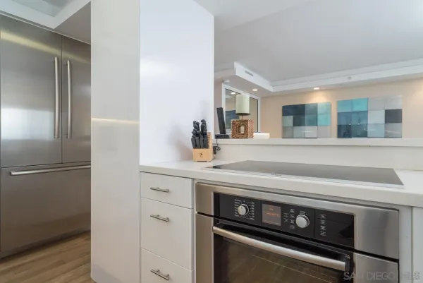 a kitchen with a stove and a refrigerator