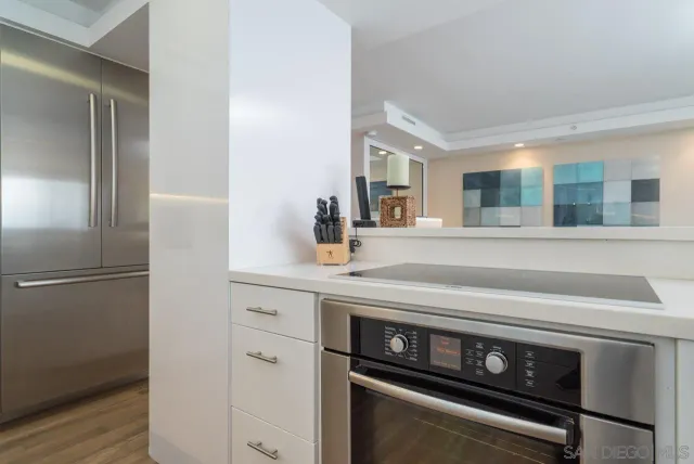 a kitchen with a stove and a refrigerator