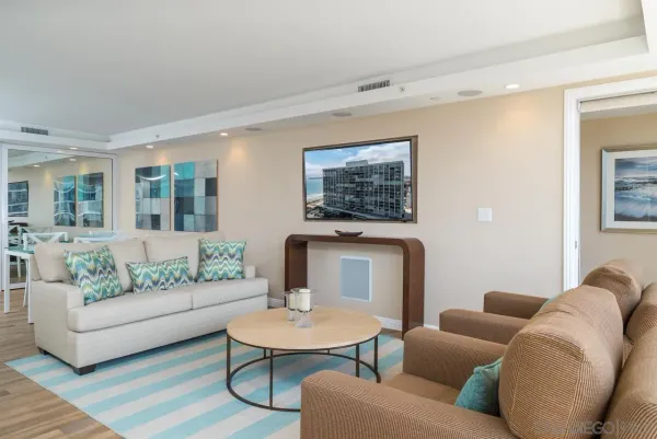 a living room with furniture and a table