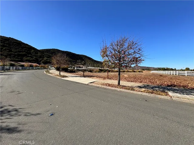a view of a road with a building in the background