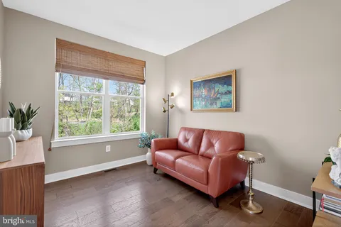 a bedroom with a bed and ceiling fan