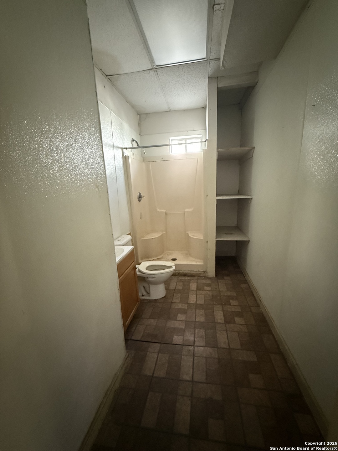 325 East Locust Street San Antonio, TX 78212 - Photo 19 of 30 a bathroom with a sink and a shower