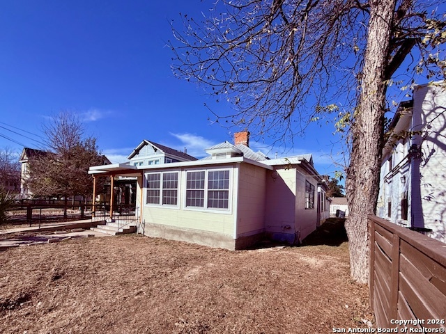 325 East Locust Street San Antonio, TX 78212 - Photo 4 of 30 a view of a house with a yard and wooden fence