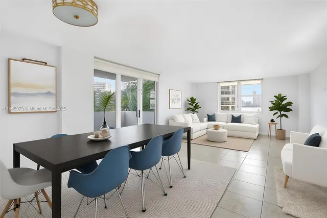 a view of a dining room with furniture and a window