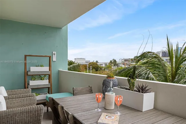 a view of a roof deck with furniture