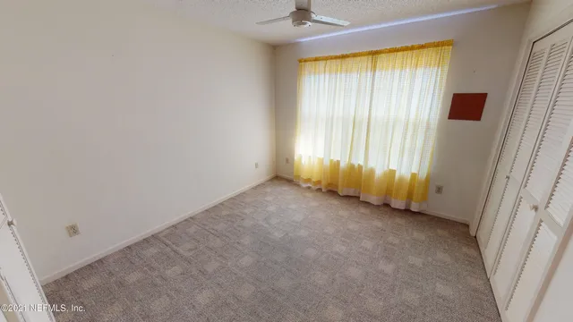 a bathroom with a granite countertop sink a bathtub and a shower
