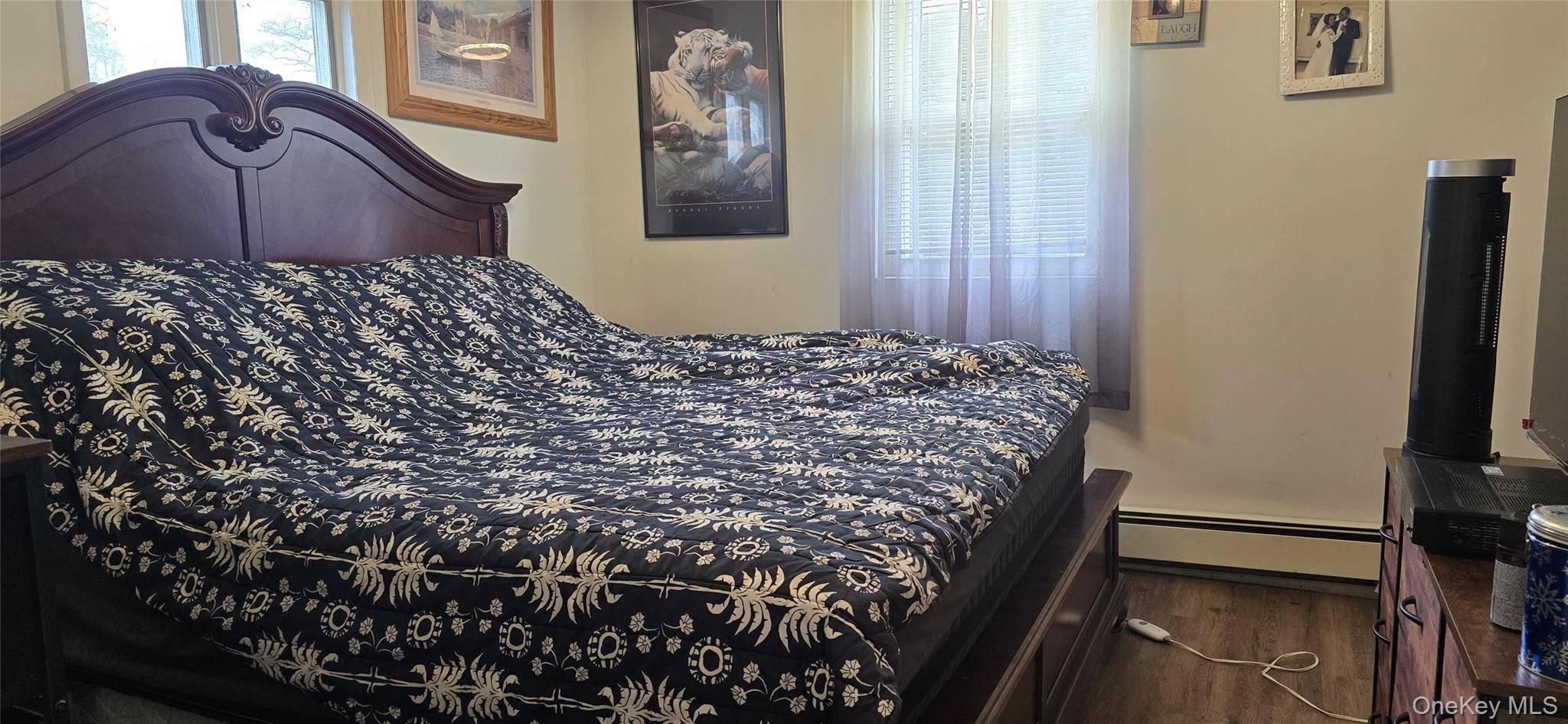 2 Ivy Road Mastic Beach, NY 11951 - Photo 19 of 25 a bedroom with a bed and wooden floor