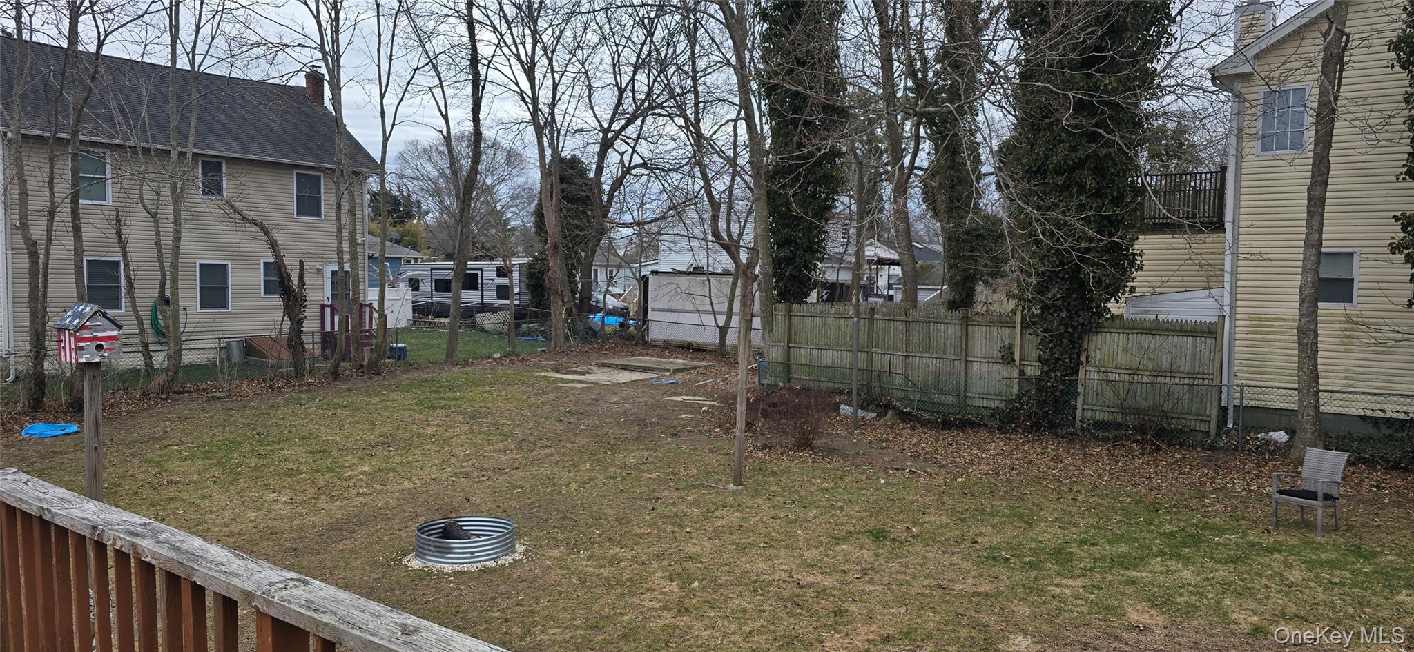 2 Ivy Road Mastic Beach, NY 11951 - Photo 20 of 25 a backyard of a house with lots of green space
