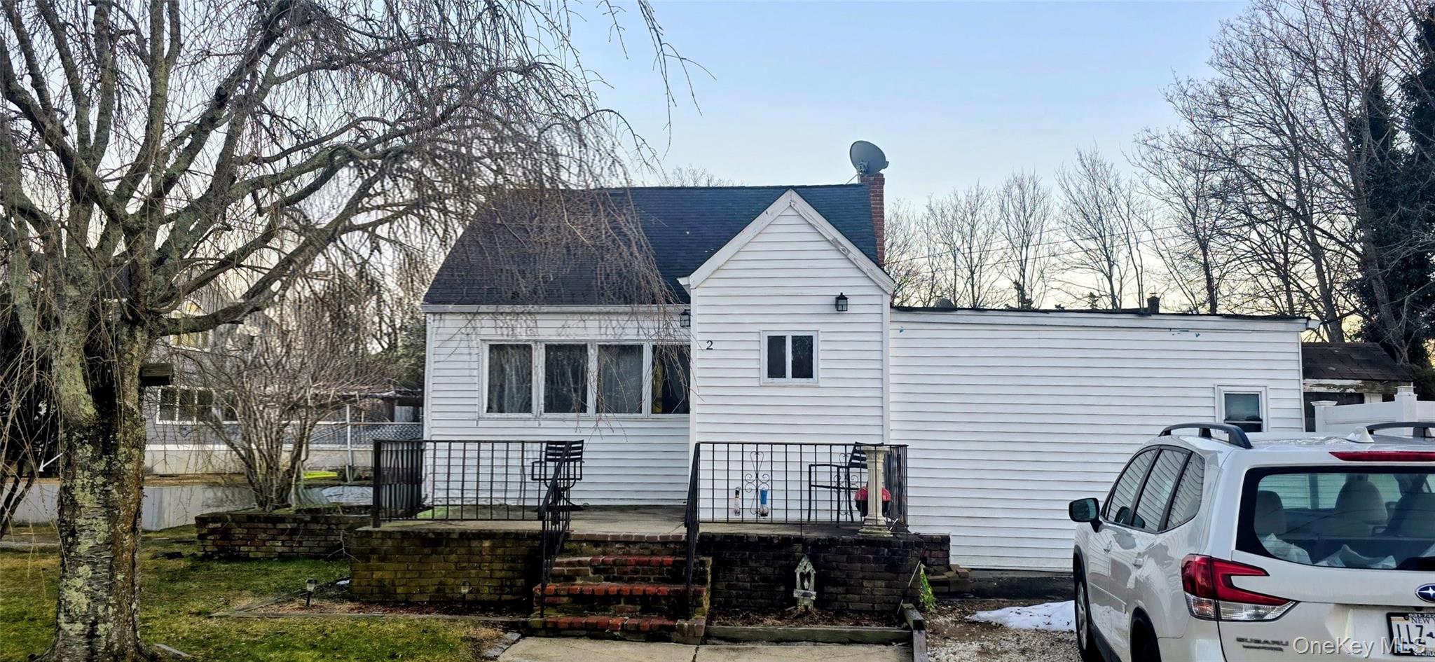 2 Ivy Road Mastic Beach, NY 11951 - Photo 2 of 25 a view of a house with a yard