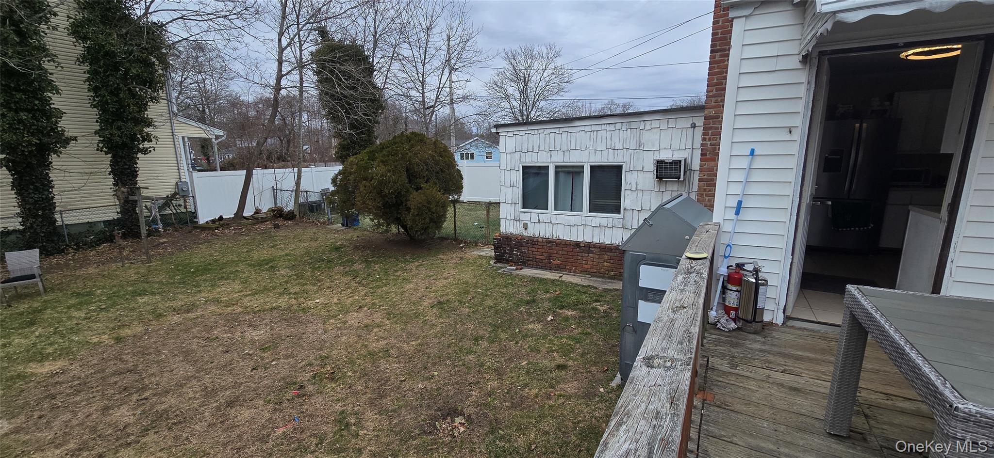 2 Ivy Road Mastic Beach, NY 11951 - Photo 24 of 25 a view of a house with backyard and a tree