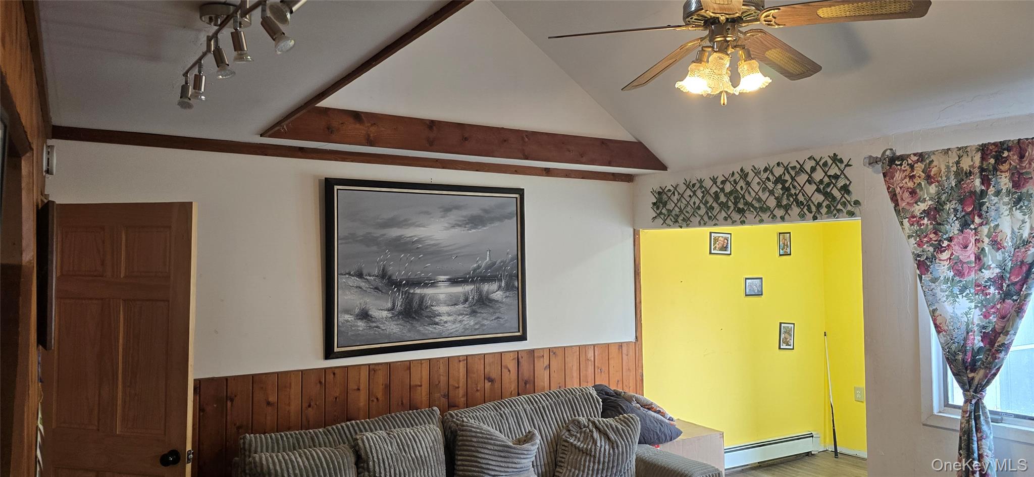 2 Ivy Road Mastic Beach, NY 11951 - Photo 8 of 25 a view of a livingroom with furniture and chandelier fan