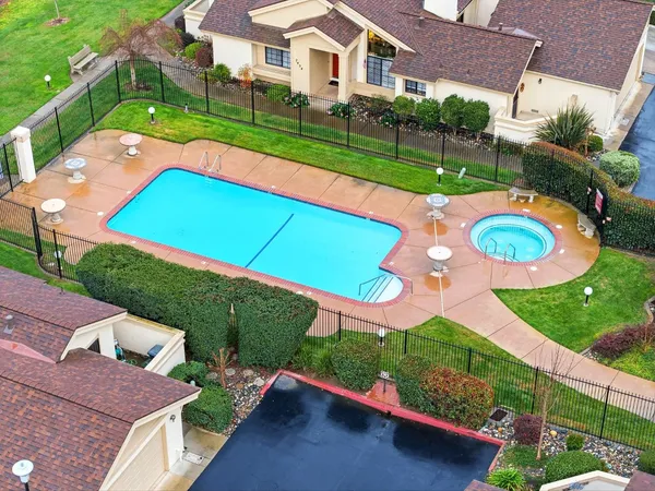an aerial view of a house with a big yard