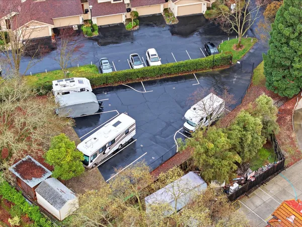 an aerial view of a house with a yard