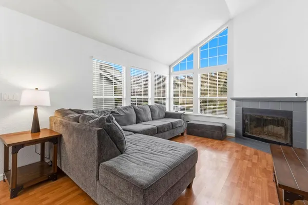 a living room with furniture and a fireplace