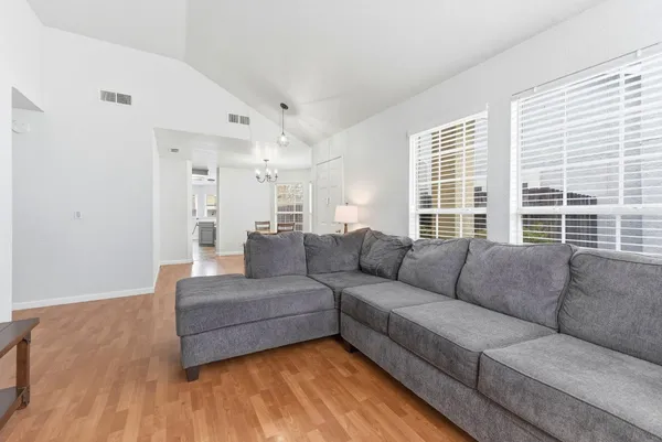 a living room with furniture and a large window