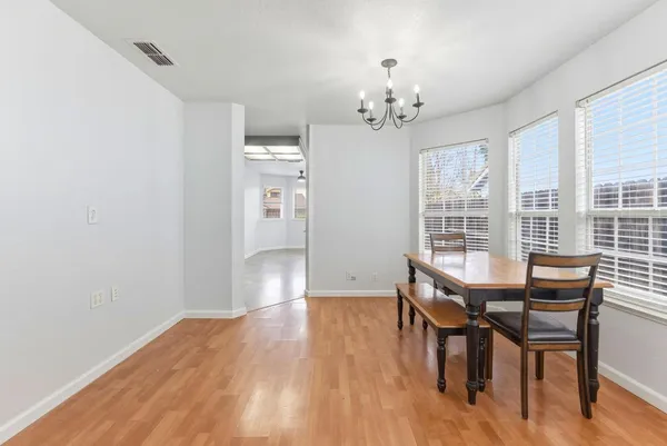 a view of a dining room with furniture window and outside view