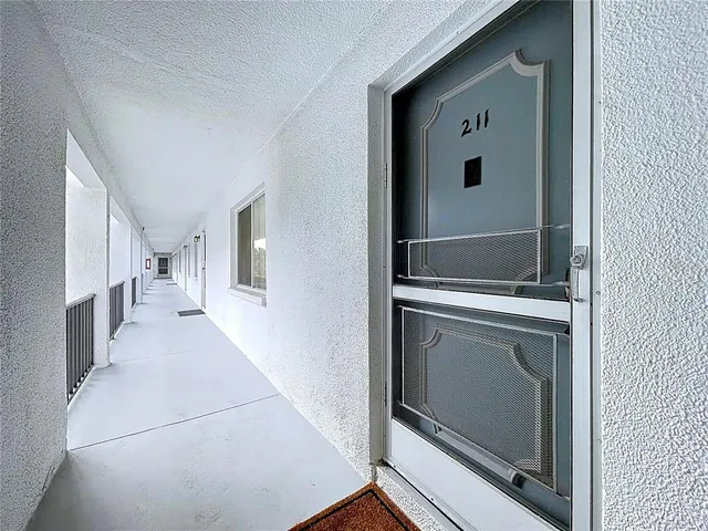 a view of a hallway with washer and dryer