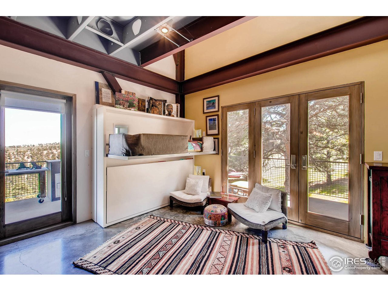 1440 Reed Ranch Road Boulder, CO 80302 - Photo 11 of 40 a living room with a couch and wooden floor