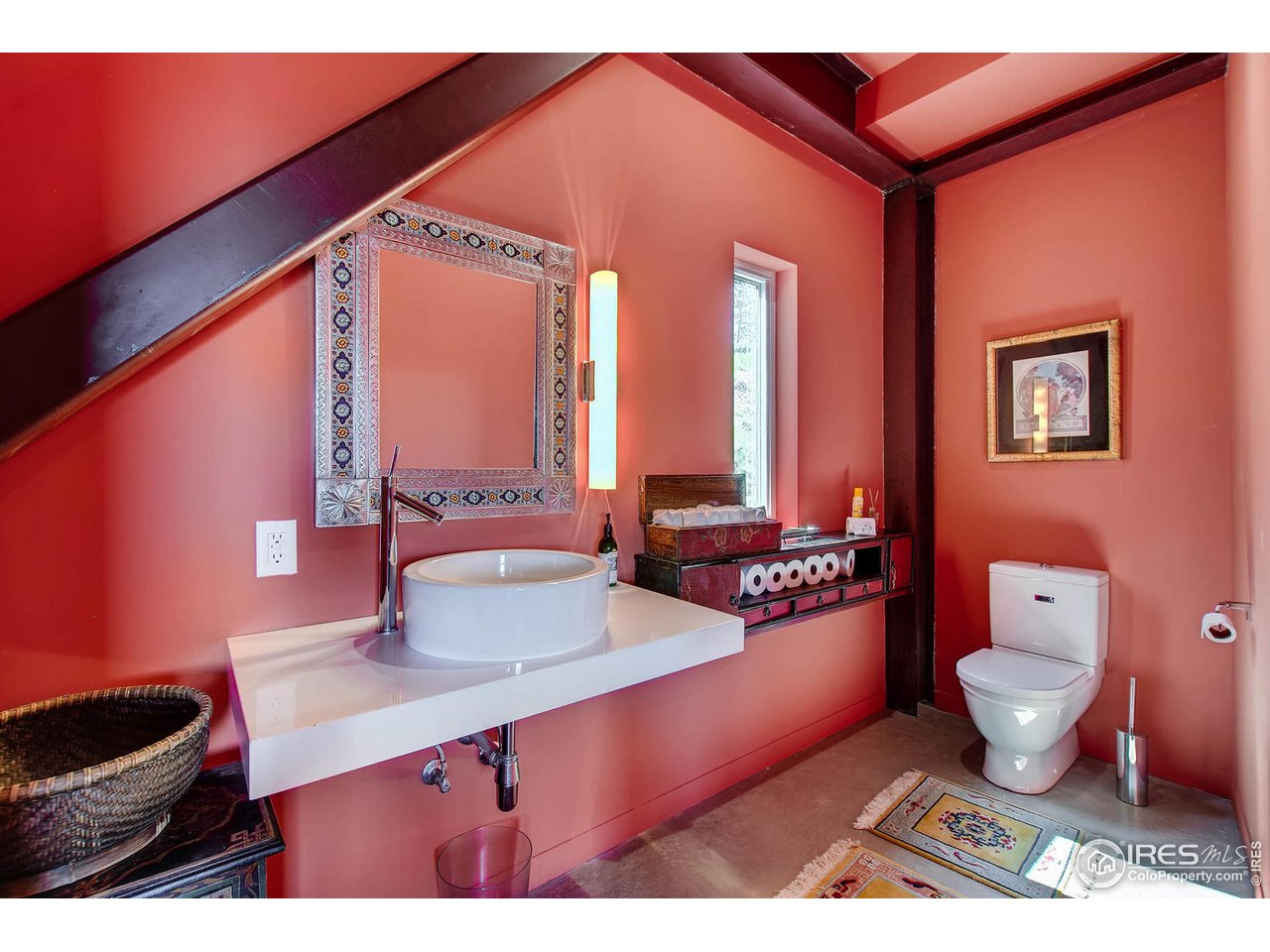 1440 Reed Ranch Road Boulder, CO 80302 - Photo 16 of 40 a bathroom with a toilet a sink and a mirror